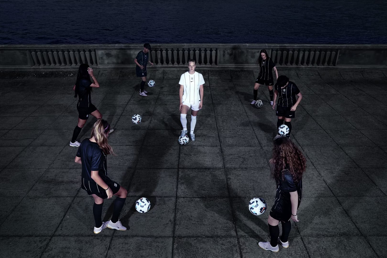 F.C. Como Women players wearing the 2025/26 Home kit during a promotional shoot for The Next Wave campaign.