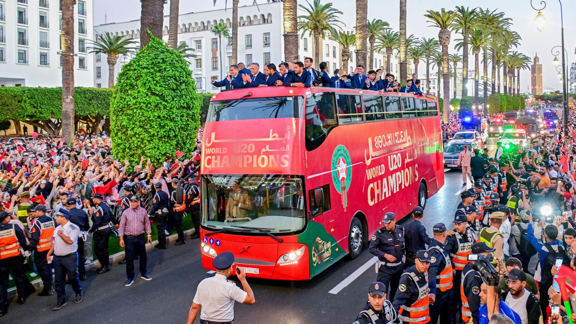 Morocco U20 national team celebrating their FIFA U20 World Cup victory with fans during the open-top bus parade in Rabat.