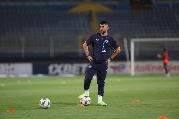 Islam Gamal Ahmed Islam Gamal Ahmed standing on the pitch during a training session with Pyramids FC, wearing official team gear and surrounded by footballs and cones.