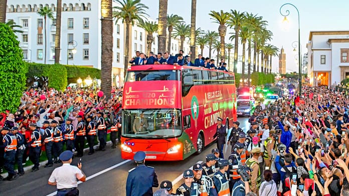 Morocco U20 national team celebrating their FIFA U20 World Cup victory with fans during the open-top bus parade in Rabat.