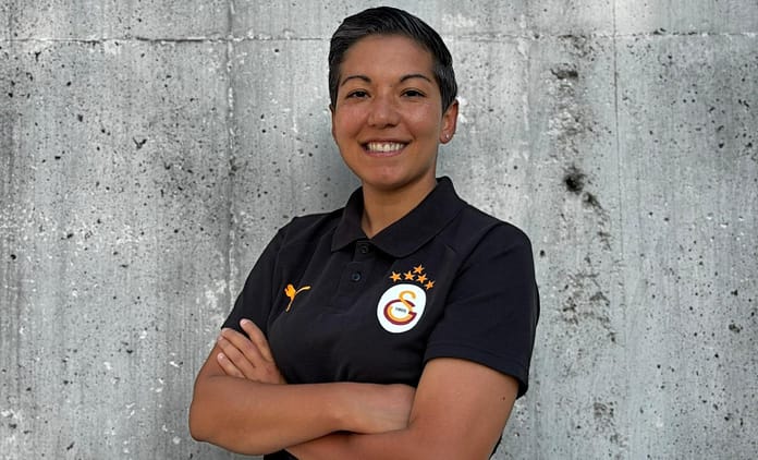 Cagla Korkmaz Çağla Korkmaz, Assistant Coach and Head of Girls Academy at Galatasaray, posing confidently in a Galatasaray polo shirt.