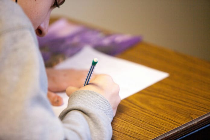 boy studying for fifa exam