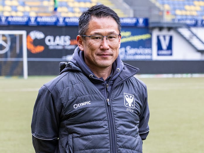 Tsuyoshi Takano 2 Tsuyoshi Takano standing on a football pitch in STVV training gear, with a focused expression, during his time at the Belgian club.