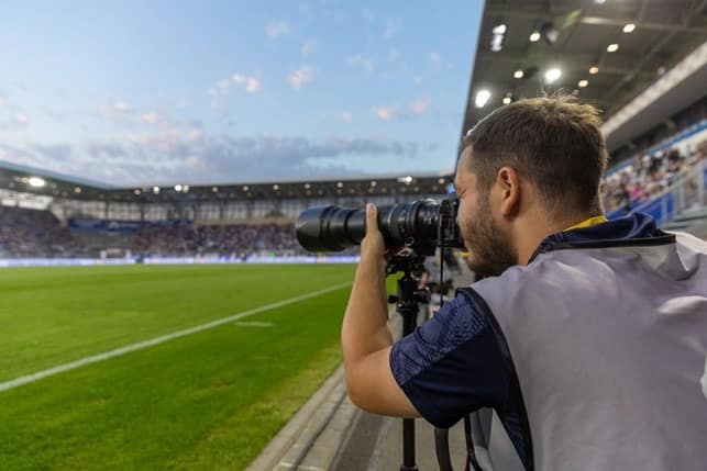 Hannes Anger Hannes Anger photographing a football match from the sidelines at FC Carl Zeiss Jena’s stadium.